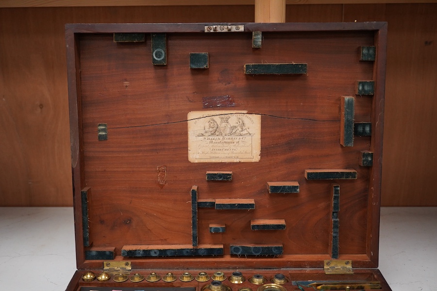 A mid 19th century folding compound and simple monocular microscope by William Harris & Co. 50 High Holborn, London, in its fitted mahogany case with paper maker’s label to inside of the lid. Condition - fair to good, so